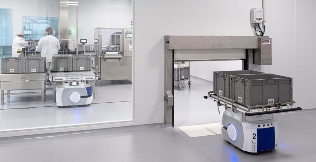 Clean room AMR transporting materials through sealed automated zones